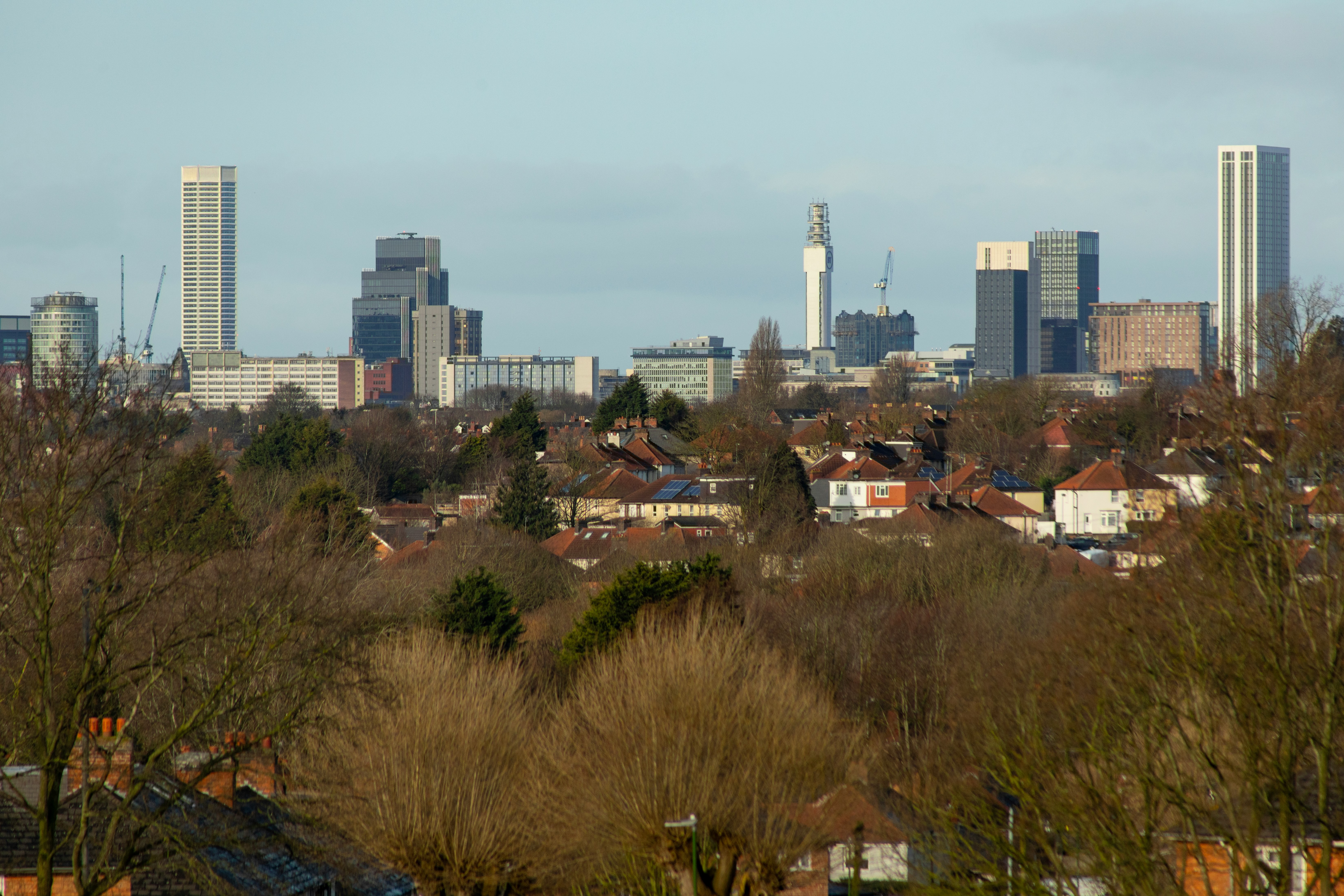 View across residential neighbourhoods towards the city centre skyline